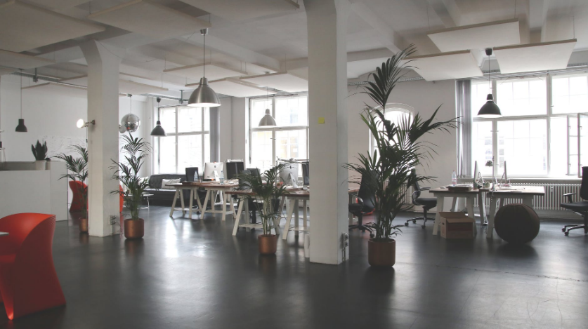 an office room with concrete floor